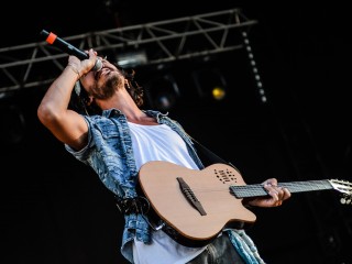 man-using-brown-and-black-electric-guitar-while-singing-167446